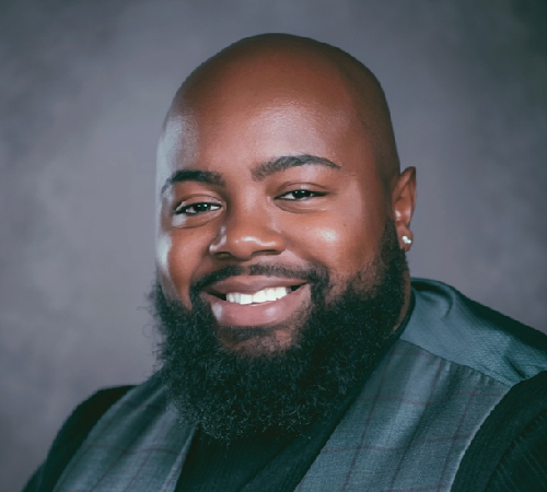 Headshot photo of LaShawn Russell smiling.